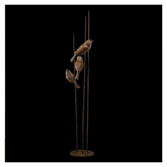 Decorative sculpture of birds on a stand against a black background