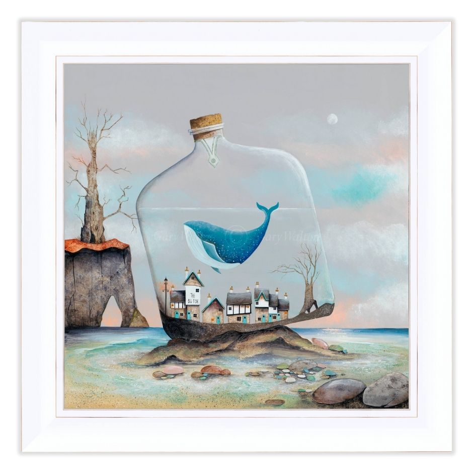 Framed artwork of a whale in a bottle with a small town on a rock, surrounded by trees and water.