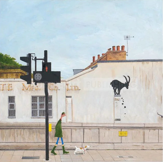 Street scene with a person walking a dog near traffic lights and a building with a goat sculpture.