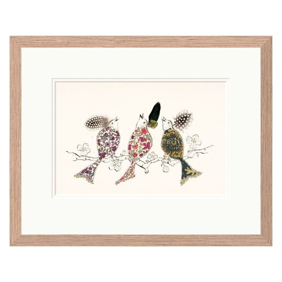 Framed artwork of three stylized birds on a branch with a white background