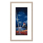 Framed artwork of a lighthouse at night with stars and a tree in the foreground.