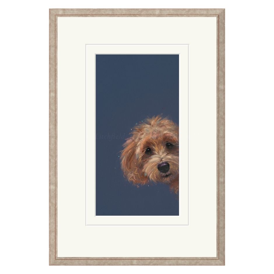 Framed artwork of a dog's face on a blue background