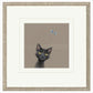 Framed artwork of a black cat with yellow eyes on a beige background
