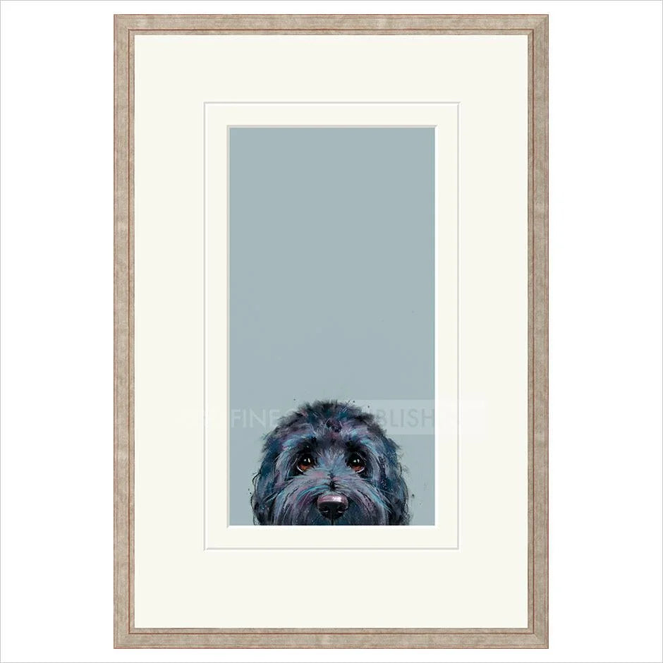 Framed artwork of a dog's face on a light blue background