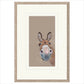 Framed artwork of a donkey's face on a beige background