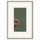 Framed artwork of a dog's face on a green background