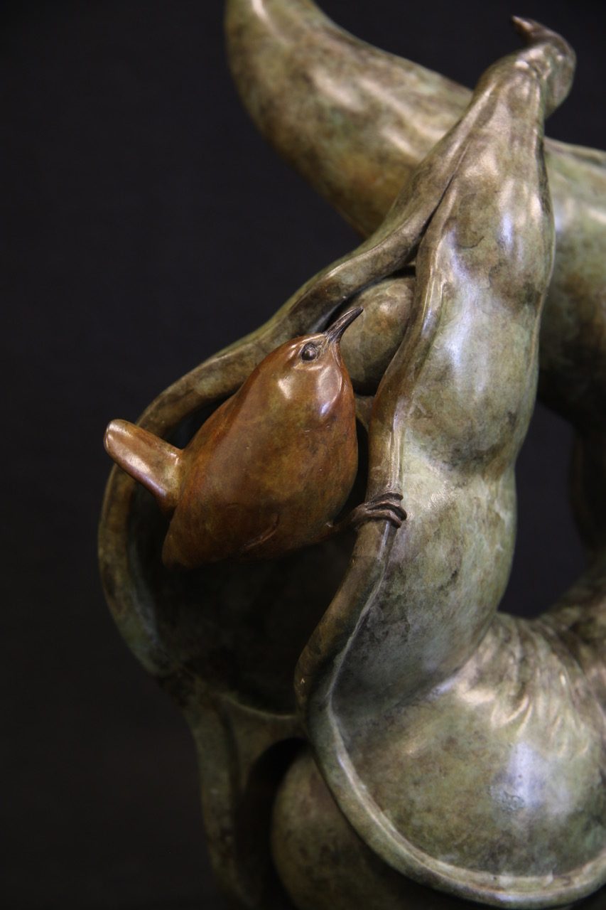 Bronze sculpture wren in pea pod