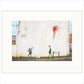 Street art of a person walking a dog with a red spray paint splash on a wall.
